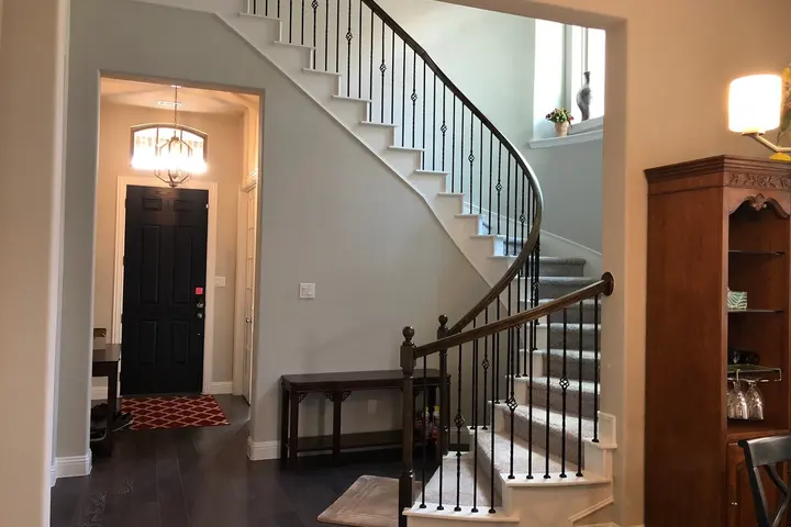 Curved staircase in the entry hall