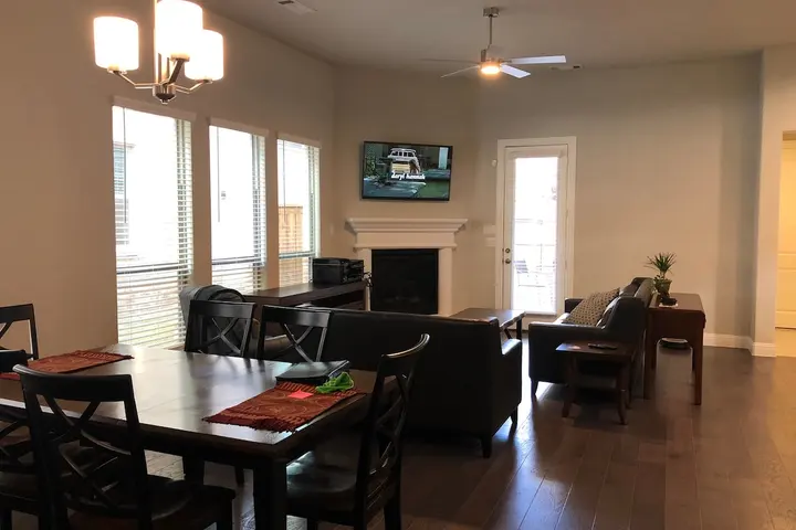 Open living and dining area with fireplace