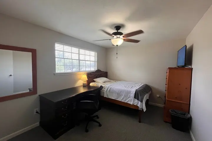 Bedroom with desk and dresser