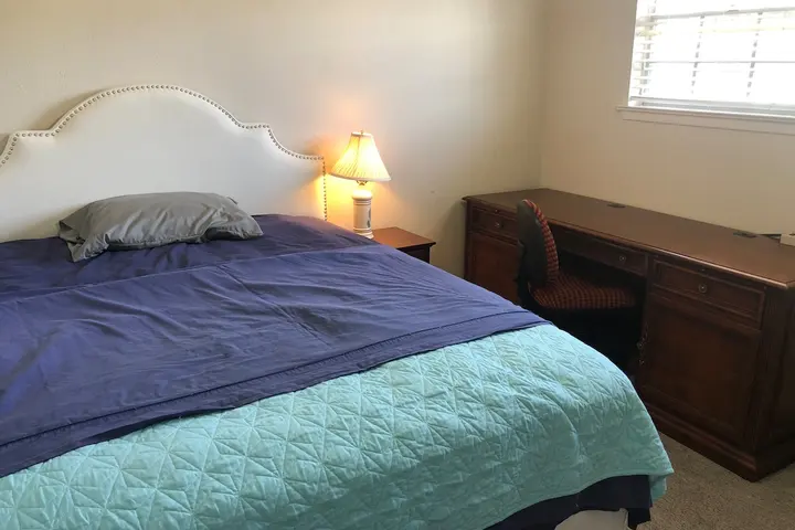 Bed with wooden headboard
