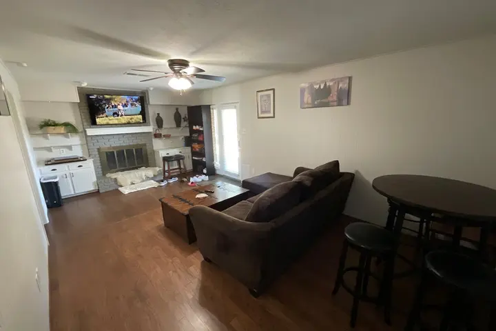 Shared living room with sofa seating and TV