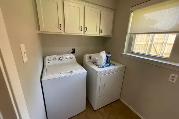 Shared laundry room with washer and dryer
