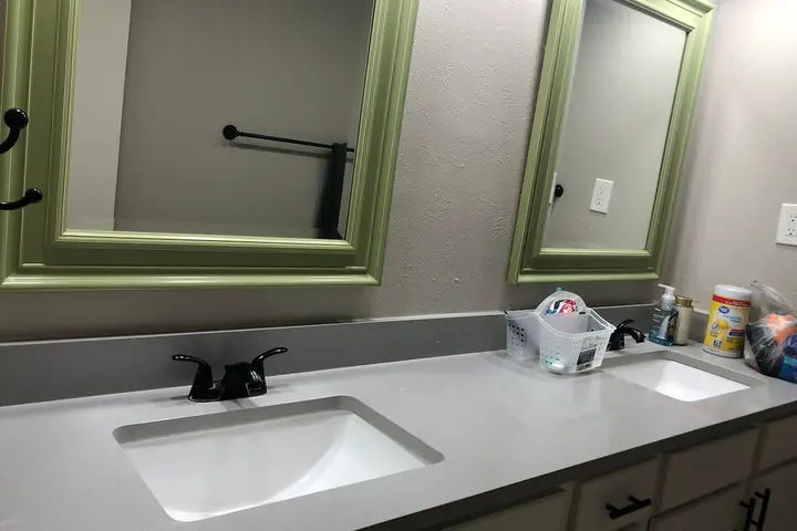 Bathroom vanity with wide mirror