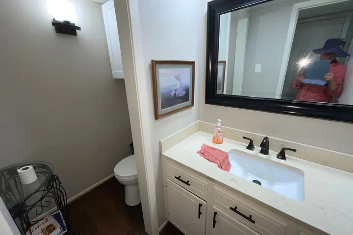 Second bathroom with vanity and mirror