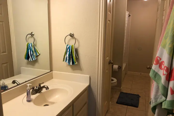 Bathroom vanity with wide mirror