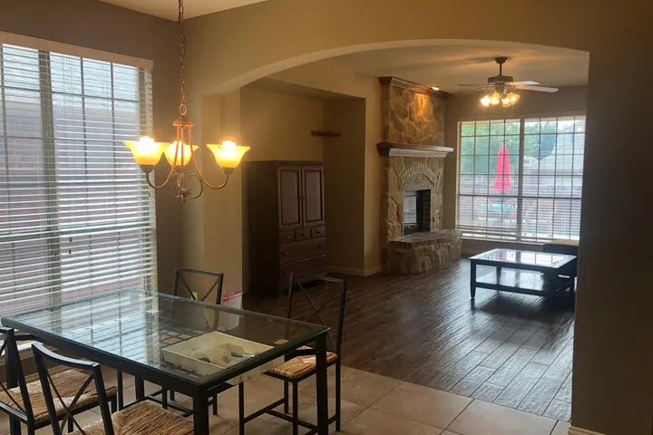 Open living and dining space with fireplace