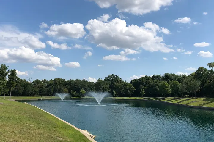 Fountain and parkland at golden hour