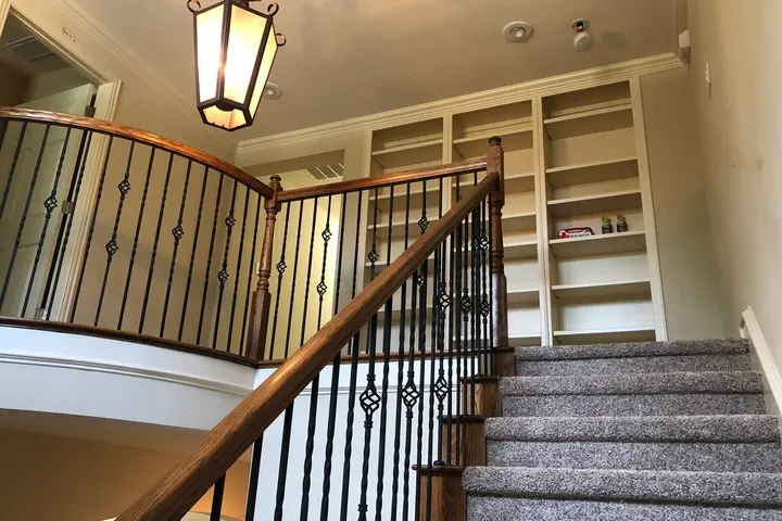 Staircase with wrought-iron railing