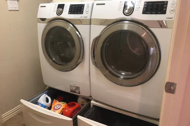 Laundry room with full-size washer and dryer